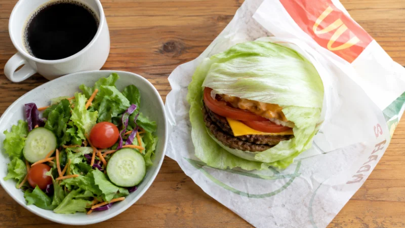 Low carb fast food options including a lettuce wrap burger and side salad
