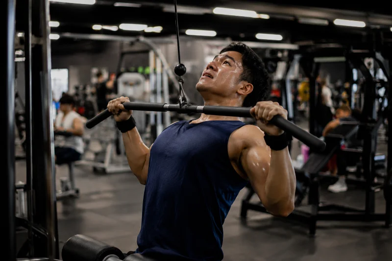 Lifter performing a lat pulldown during a back and tricep workout
